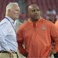 FILE - In this Aug. 26, 2016, file photo, Cleveland Browns owner Jimmy Haslam, left, and head coach Hue Jackson watch warm-ups before an NFL preseason football game against the Tampa Bay Buccaneers in Tampa, Fla. The Browns finished the season 1-15. (AP Photo/Phelan M. Ebenhack, File)