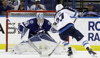 Winnipeg Jets right wing Nikolaj Ehlers (27), of Denmark, scores past Tampa Bay Lightning goalie Andrei Vasilevskiy (88), of Russia, on a penalty shot during the second period of an NHL hockey game Tuesday, Jan. 3, 2017, in Tampa, Fla. (AP Photo/Chris O&#39;Meara)