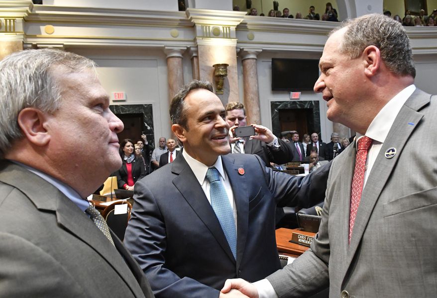 In this Jan. 3, 2017 file photo, Kentucky Gov. Matt Bevin, center, and Kentucky Senate President Robert Stivers, left, congratulate Jeff Hoover following his being voted in as Speaker of the House. (AP Photo/Timothy D. Easley) **FILE**