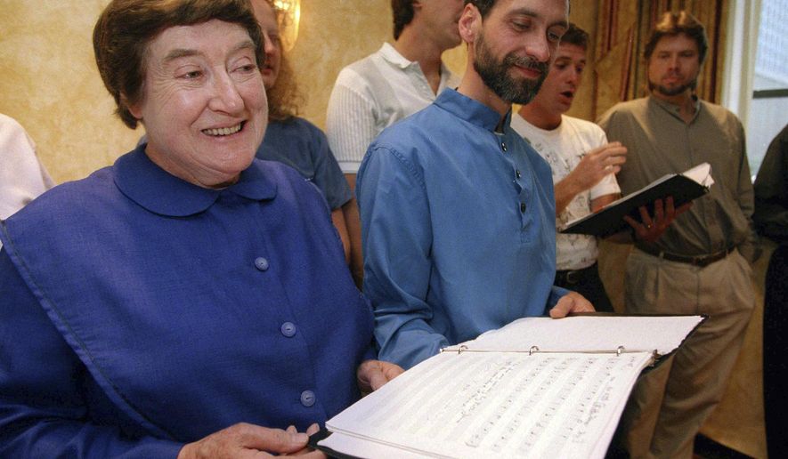 FILE - In this Sept. 13, 1995 file photo, Sister Frances Carr, left, and Brother Arnold Hadd of the Shaker Village in Sabbathday Lake, Maine, sing with the Boston Camerata during a rehearsal at the Warwick Hotel in New York. Carr, one of the last remaining Shakers, died Monday, Jan. 2, 2017, after a brief battle with cancer. She was 89. (AP Photo/Adam Nadel, File)