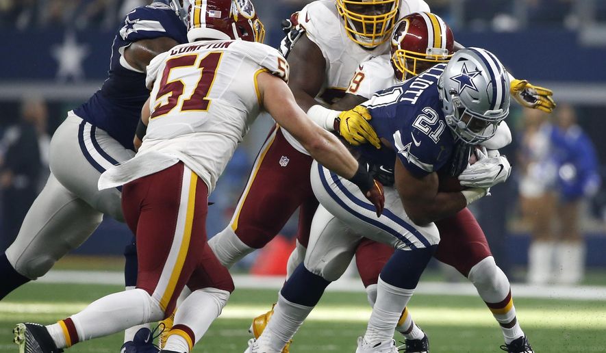 FILE - In this Nov. 24, 2016 file photo, Dallas Cowboys running back Ezekiel Elliott (21) struggles for extra yardage as Washington Redskins&#x27; Will Compton (51) and Donte Whitner Sr., rear, make the stop in the first half of an NFL football game, in Arlington, Texas. More than just struggling against the run and pass, Washington was worst in the league in third-down defense and among the worst teams in the red zone. Whether that’s scheme or personnel is a matter of debate but most likely a combination of the two. (AP Photo/Ron Jenkins, File)