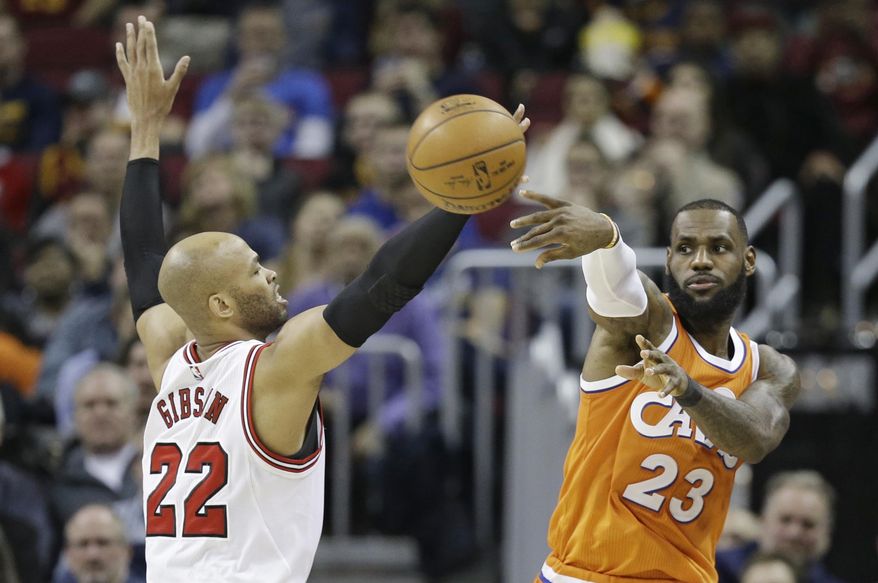 Cleveland Cavaliers' LeBron James (23) passes against Chicago Bulls' Taj Gibson (22) in the second half of an NBA basketball game, Wednesday, Jan. 4, 2017, in Cleveland. The Bulls won 106-94. (AP Photo/Tony Dejak)