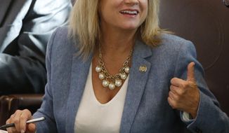 Oklahoma state Rep. Leslie Osborn, R-Mustang, gestures as she talks with a colleague on the House floor in Oklahoma City, Wednesday, Jan. 4, 2017. Oklahoma&#x27;s Department of Education says it needs $221 million more in funding for the next school year just to keep pace with student growth. (AP Photo/Sue Ogrocki)
