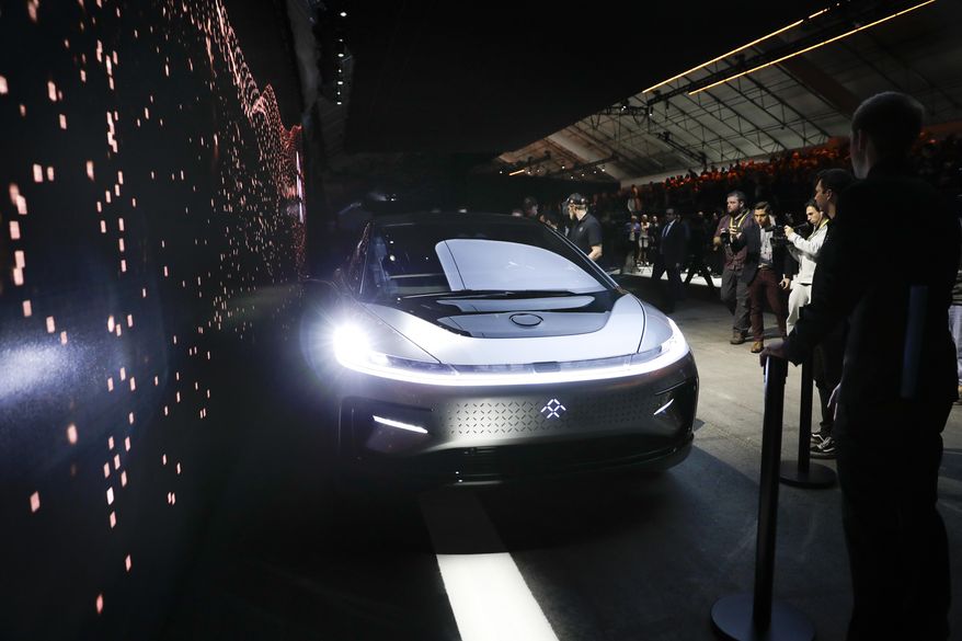 Faraday Future's FF91 electric car is unveiled during a news conference at CES International Tuesday, Jan. 3, 2017, in Las Vegas. (AP Photo/Jae C. Hong)