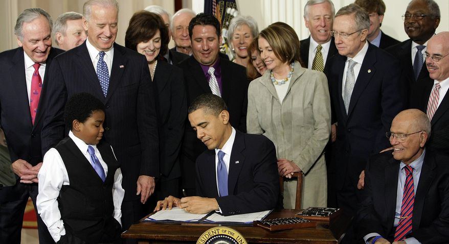 FILE - In this Tuesday, March 23, 2010 file photo, President Barack Obama signs the Patient Protection and Affordable Care Act in the East Room of the White House in Washington. "Obamacare" led to health care coverage for some 20 million Americans, including about 4 million Hispanics and 3 million blacks, according to federal statistics. However, its fate is uncertain because of Trump’s vow to repeal and replace it. (AP Photo/J. Scott Applewhite)