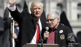 FILE - In this April 1, 2014, file photo, Donald Trump, left, is joined by Carl Paladino during a gun rights rally at the Empire State Plaza in Albany, N.Y. On Wednesday, Jan 4, 2017, the wealthy businessman who co-chaired Trump&#39;s campaign in New York, refuted reports that he was on the outs with the transition team and not welcome at a fund-raiser Thursday, Jan. 5, in his hometown of Buffalo, N.Y. (AP Photo/Mike Groll, File)