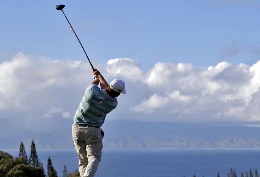 Ryan Moore hits from the 18th tee during the first round of the Tournament of Champions golf event, Thursday, Jan. 5, 2017, at Kapalua Plantation Course in Kapalua, Hawaii. (AP Photo/Matt York)