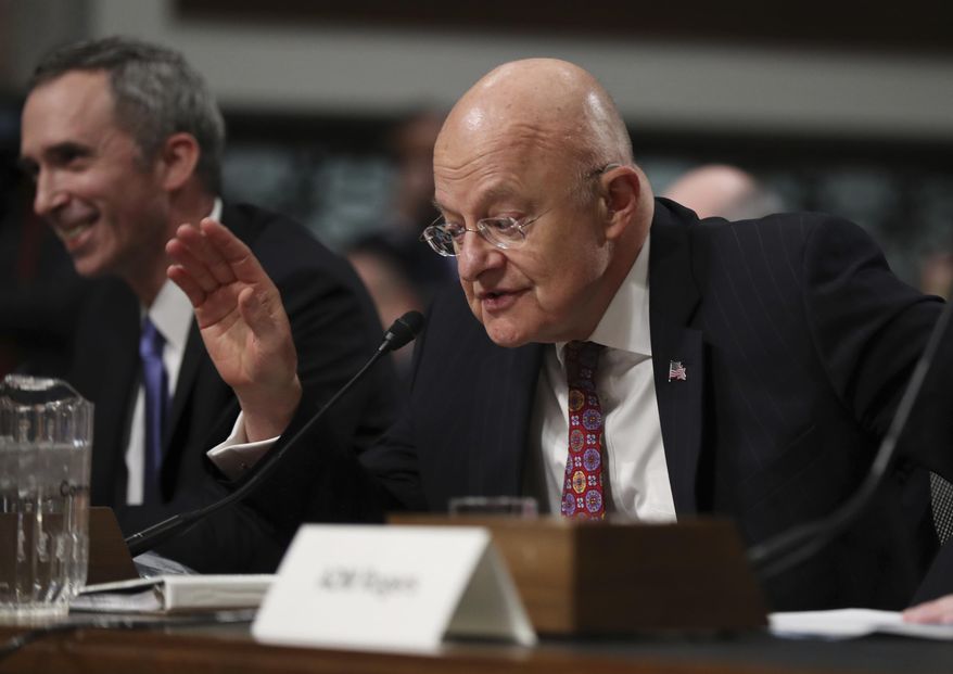 Director of National Intelligence James Clapper, right, with Defense Undersecretary of Defense for Intelligence Marcel Lettre II, testifies on Capitol Hill in Washington, Thursday, Jan. 5, 2017, before the Senate Armed Services Committee hearing: "Foreign Cyber Threats to the United States." (AP Photo/Manuel Balce Ceneta)