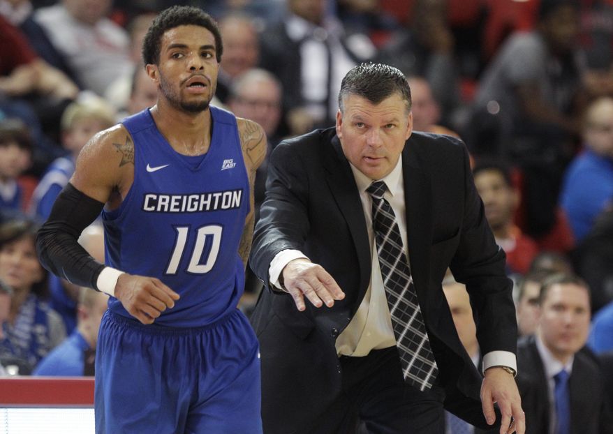 Creighton head coach Greg McDermott, right, sends Maurice Watson Jr. (10) back into the game during the second half of an NCAA college basketball game against St. John's Wednesday, Jan. 4, 2017, in New York. Creighton won 85-72. (AP Photo/Frank Franklin II)