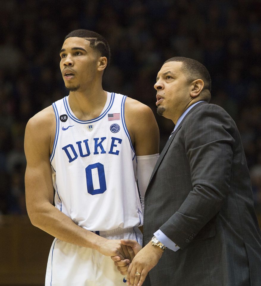 Duke assistant coach Jeff Capel, right, speaks with Duke's Jayson Tatum (0) during the second half of an NCAA college basketball game against Georgia Tech in Durham, N.C., Wednesday, Jan. 4, 2017. Duke defeated Georgia Tech 110-57. (AP Photo/Ben McKeown)