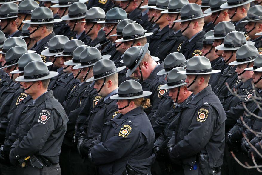 Pennsylvania State Troopers line up outside the Blair County Convention Center in Altoona, Pa., following a memorial service Thursday, Jan. 5, 2017, for Pennsylvania State Trooper Landon E. Weaver who was killed in the line of duty Dec. 30. Weaver, 23, had been on the force for less than six months. (AP Photo/Gene J. Puskar)