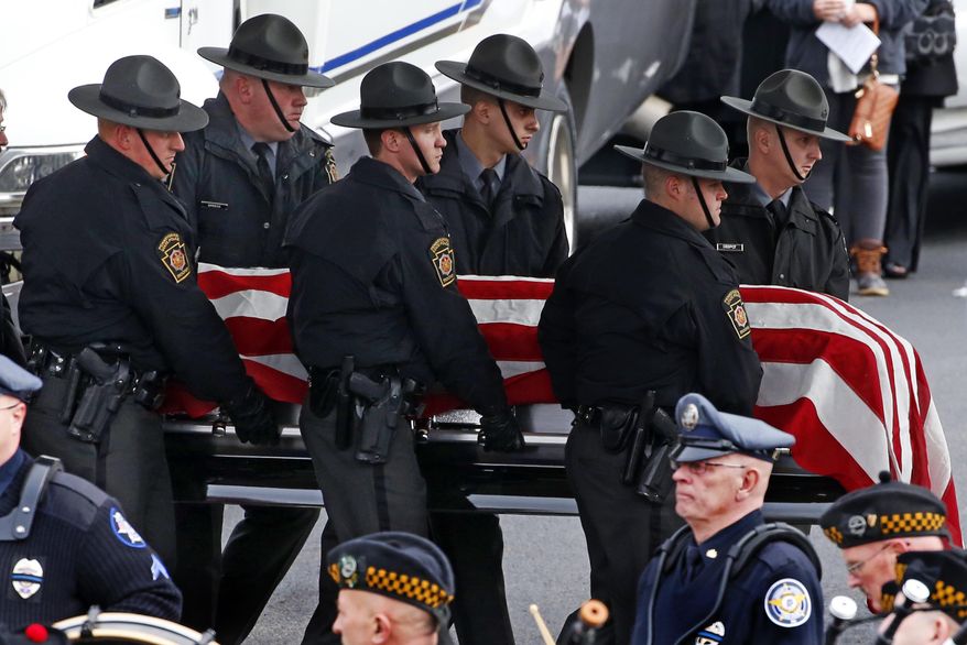 Pennsylvania State Trooper Landon E. Weaver's casket is carried to a hearse by troopers after a memorial service at the Blair County Convention Center in Altoona, Pa., Thursday, Jan. 5, 2017. Weaver was killed answering a domestic disturbance call on Dec. 30. (AP Photo/Gene Puskar)