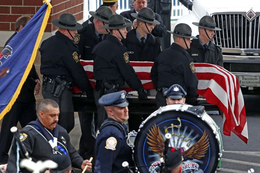 Pennsylvania State Trooper Landon E. Weaver's casket is carried to a hearse following a memorial service at the Blair County Convention Center in Altoona, Pa., Thursday, Jan. 5, 2017. Trooper Weaver was killed answering a domestic disturbance call on Dec. 30. Weaver, 23, had been on the force for less than six months. (AP Photo/Gene Puskar)