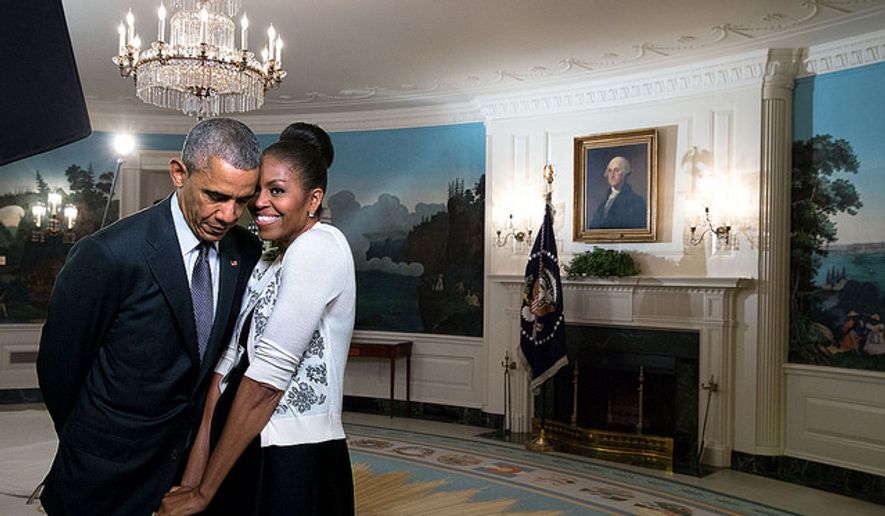 President Obama and his wife Michelle snuggle at the White House in this White House photo.
