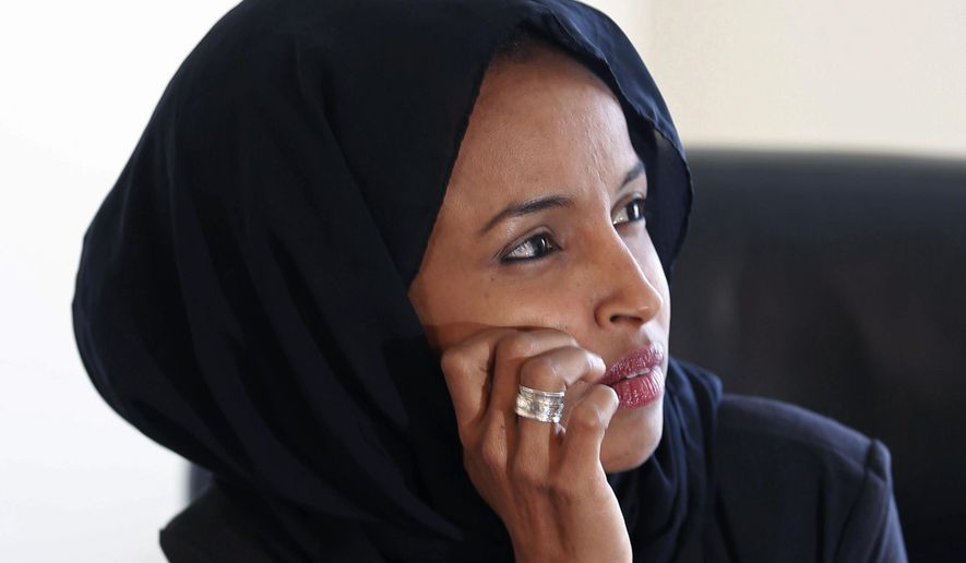 In this Thursday, Jan. 5, 2017 photo, new State Rep. Ilhan Omar is interviewed in her office two days after the 2017 Legislature convened in St. Paul, Minn. Omar is the first Somali-American to be elected to a state legislature in the U.S. The 33-year-old wife, mother, refugee and immigrant reflected on her many roles and how she&#39;ll try to voice and inspiration for denigrated minority communities like her own. (AP Photo/Jim Mone)
