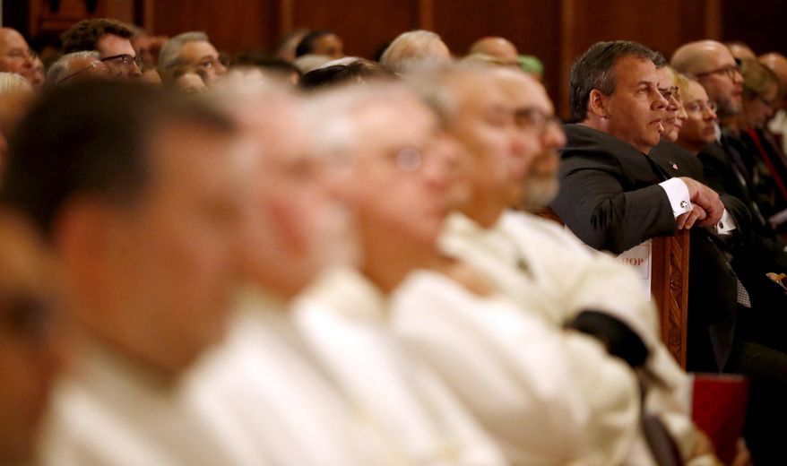 New Jersey Gov. Chris Christie, right, attends a Mass ceremony installing Joseph Cardinal Tobin as the new archbishop of Newark, Friday, Jan. 6, 2017, in Newark, N.J. Tobin succeeds Archbishop John Myers, who reached the mandatory retirement age of 75 in July. (AP Photo/Julio Cortez)