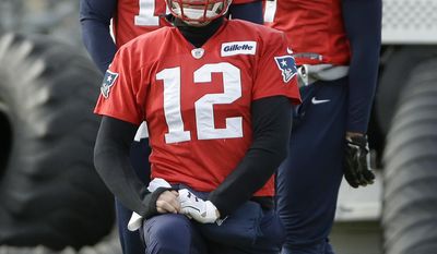 New England Patriots quarterbacks Tom Brady (12), Jimmy Garoppolo, top left, and Jacoby Brissett, top right, warm up during an NFL football practice, Thursday, Jan. 5, 2017, in Foxborough, Mass. (AP Photo/Steven Senne)