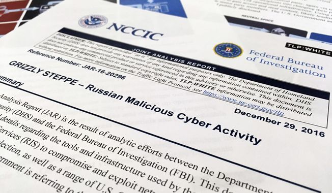 The first page of the Joint Analysis Report narrative by the Department of Homeland Security and federal Bureau of Investigation and released on Dec. 29, 2016, is photographed in Washington, Jan. 6, 2017. Computer security specialists say the technical details in the narrative that the U.S. said would show whether computers had been infiltrated by Russian intelligence services were poorly done and potentially dangerous. Cybersecurity firms ended up counseling their customers to proceed with extreme caution after a slew of false positives led back to sites such as Amazon and Yahoo Inc. Companies and organizations were following the government’s advice Dec. 29 and comparing digital logs recording incoming network traffic to their computers and finding matches to a list of hundreds of internet addresses the Homeland Security Department had identified as indicators of malicious Russian intelligence services cyber activity. (AP Photo/Jon Elswick)