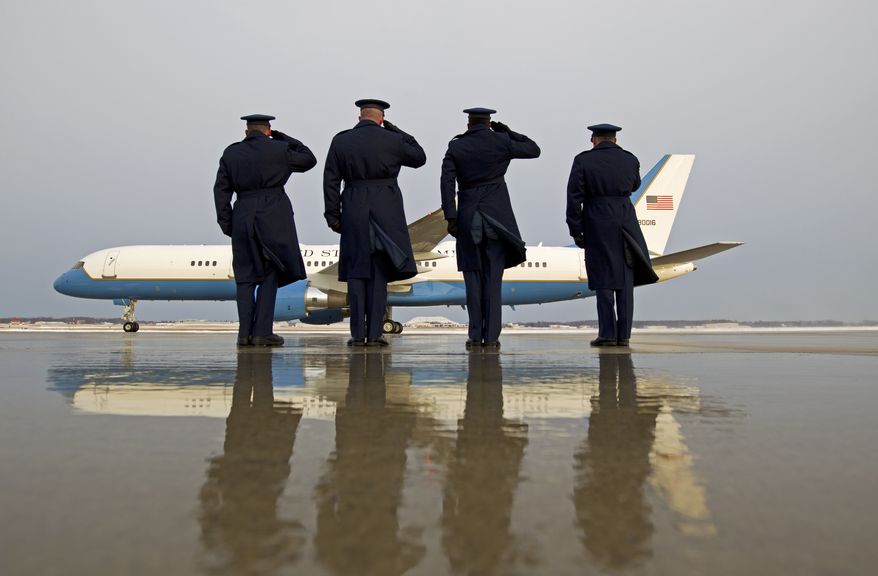 Military personnel salute as Air Force One with President Barack Obama aboard, departs at Andrews Air Force Base, Md., Saturday, Jan. 7, 2017, en route to Jacksonville, Fla., to attend a wedding. ( AP Photo/Jose Luis Magana)
