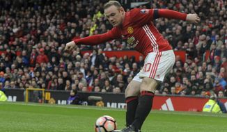 Manchester United&#x27;s Wayne Rooney shoots at goal during the English FA Cup Third Round match between Manchester United and Reading at Old Trafford in Manchester, England, Saturday, Jan. 7, 2017. United won the match 4-0. (AP Photo/Rui Vieira)