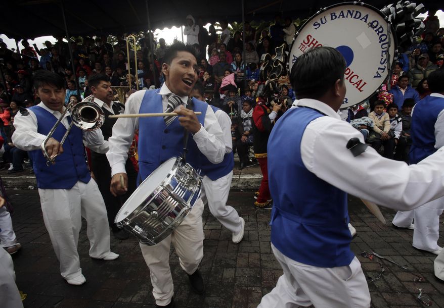 A band plays during "La Diablada" festival in Pillaro, Ecuador, Friday, Jan. 6, 2017. A procession of dancers in elaborate devil masks is the centerpiece of an annual festival (AP Photo/Dolores Ochoa)