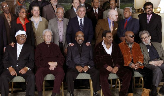 FILE - In this Friday, Jan. 13, 2006 file photo, Jazz legends pose for a group portrait of National Endowment for the Arts Jazz Masters of the past and present, in New York. At foreground right is writer Nat Hentoff. His son, Tom Hentoff, said his father died on Saturday, Jan. 7, 2017, from natural causes at his Greenwich Village apartment. He was 91. Also in the photo are, from left, front row: Clark Terry, Frank Foster, James Moody, Chico Hamilton, Roy Haynes and jazz writer Nat Hentoff; middle row: John Levy, Nancy Wilson, Chick Corea, Barry Harris, Tony Bennett, Jim Hall, Slide Hampton and David Baker; top row: Ron Carter, Bob Brookmeyer, Ray Barretto, Buddy DeFranco, Paquito D&#x27;Rivera, McCoy Tyner and Freddie Hubbard. (AP Photo/Bebeto Matthews)