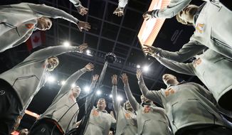 Clemson players pose for a 360 degree camera during media day for the NCAA college football playoff championship game against Alabama Saturday, Jan. 7, 2017, in Tampa, Fla. (AP Photo/David J. Phillip)