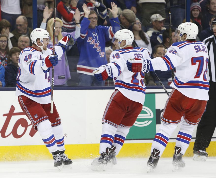 New York Rangers&#39; Michael Grabner, left, of Austria, celebrates his game-winning goal against the Columbus Blue Jackets with teammates Jesper Fast, center, of Sweden, and Brady Skjei during the third period of an NHL hockey game Saturday, Jan. 7, 2017, in Columbus, Ohio. The Rangers beat the Blue Jackets 5-4. (AP Photo/Jay LaPrete)