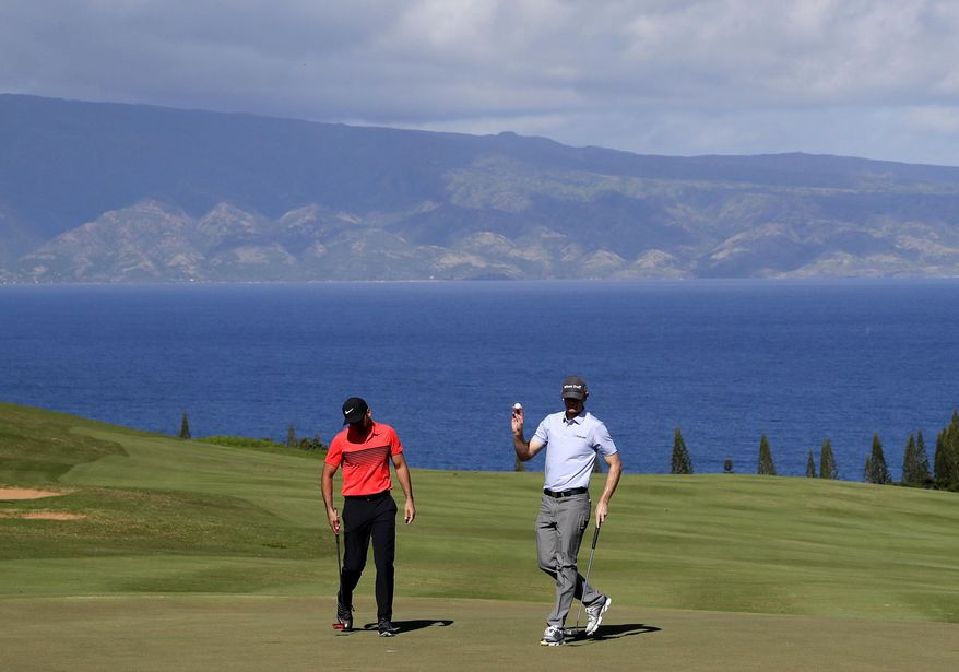Brendan Steele waves after making his birdie putt as Jason Day, of Australia, left, looks down during the third round of the Tournament of Champions golf event, Saturday, Jan. 7, 2017, at Kapalua Plantation Course in Kapalua, Hawaii. (AP Photo/Matt York)