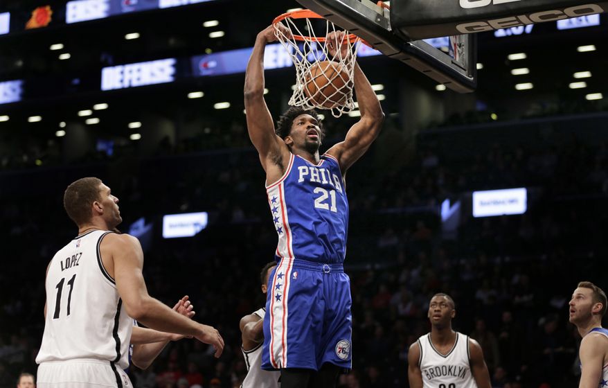 Philadelphia 76ers' Joel Embiid (21) dunks during the first half of the NBA basketball game against the Brooklyn Nets at the Barclays Center, Sunday, Jan. 8, 2017, in New York. (AP Photo/Seth Wenig)