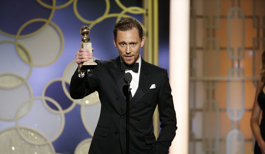 This image released by NBC shows Tom Hiddleston with the award for best actor in a limited series or TV movie for &quot;The Night Manager,&quot; at the 74th Annual Golden Globe Awards at the Beverly Hilton Hotel in Beverly Hills, Calif., on Sunday, Jan. 8, 2017. (Paul Drinkwater/NBC via AP)