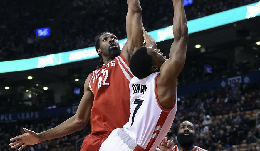 Toronto Raptors guard Kyle Lowry (7) is fouled by Houston Rockets center Nene Hilario (42) during first-half NBA basketball game action in Toronto, Sunday, Jan. 8, 2017. (Frank Gunn/The Canadian Press via AP)