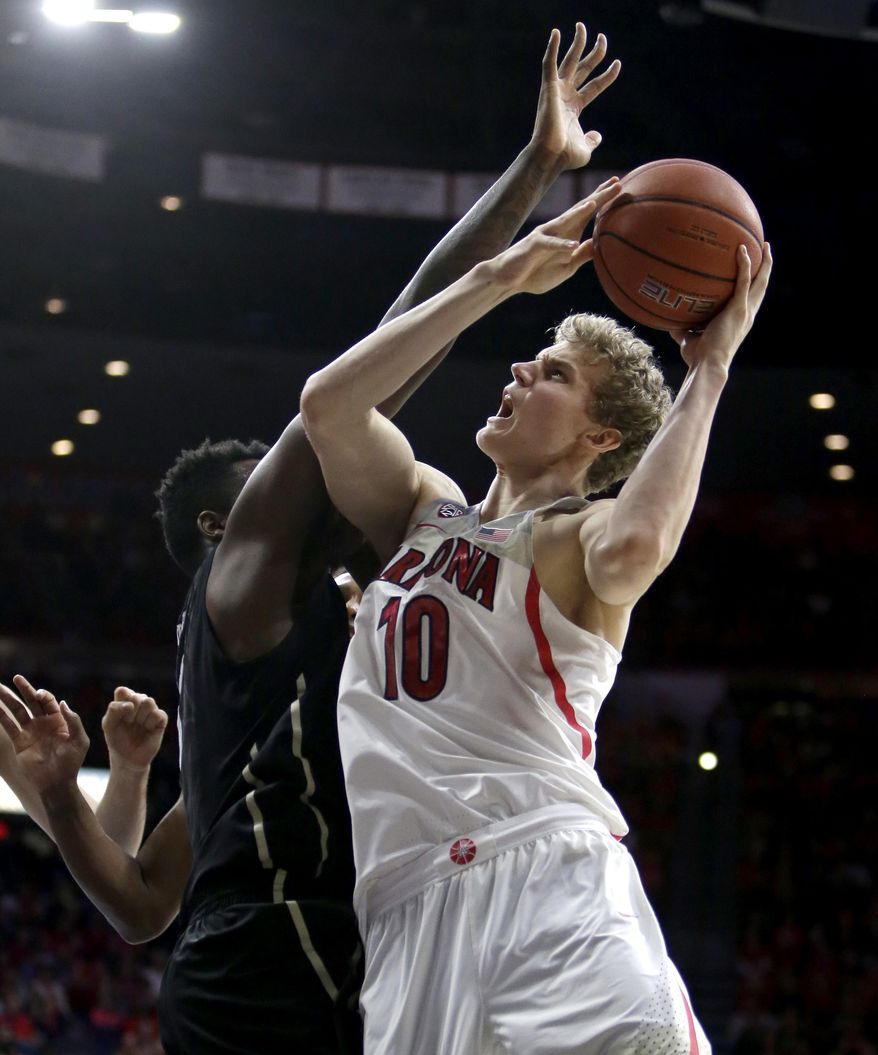 Arizona forward Lauri Markkanen (10) draws the foul from Colorado forward Wesley Gordon during the second half of an NCAA college basketball game, Saturday, Jan. 7, 2017, in Tucson, Ariz. Arizona defeated Colorado 82-73. (AP Photo/Rick Scuteri)