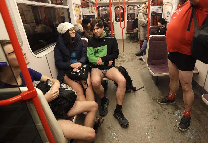 Passengers take part in the No Pants Subway Ride in Prague, Czech Republic, Sunday, Jan. 8, 2017. The No Pants Subway Ride began in 2002 in New York as a stunt and has taken place in cities around the world since then. (AP Photo/Petr David Josek)