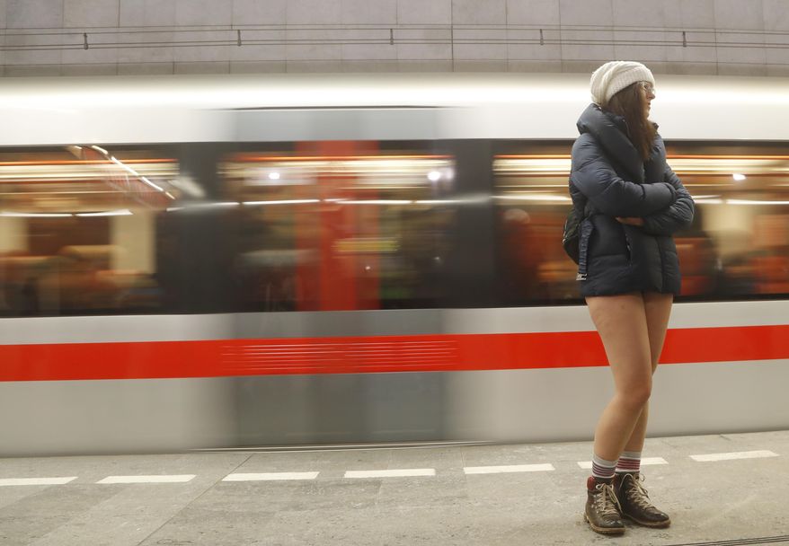 A passenger not wearing pants takes part in the No Pants Subway Ride in Prague, Czech Republic, Sunday, Jan. 8, 2017. The No Pants Subway Ride began in 2002 in New York as a stunt and has taken place in cities around the world since then. (AP Photo/Petr David Josek)