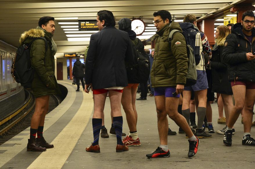 Young people with no pants wait for the subway train during the event 'No Pants Subway Ride' in Berlin, Germany, Sunday Jan. 8, 2017. What started in New York City in 2002 with a just a handful of people has blossomed into a worldwide movement involving thousands. No Pants rides are scheduled Sunday in about 50 cities across the U.S., Canada, Europe and Australia. (Maurizio Gambarini/dpa via AP)
