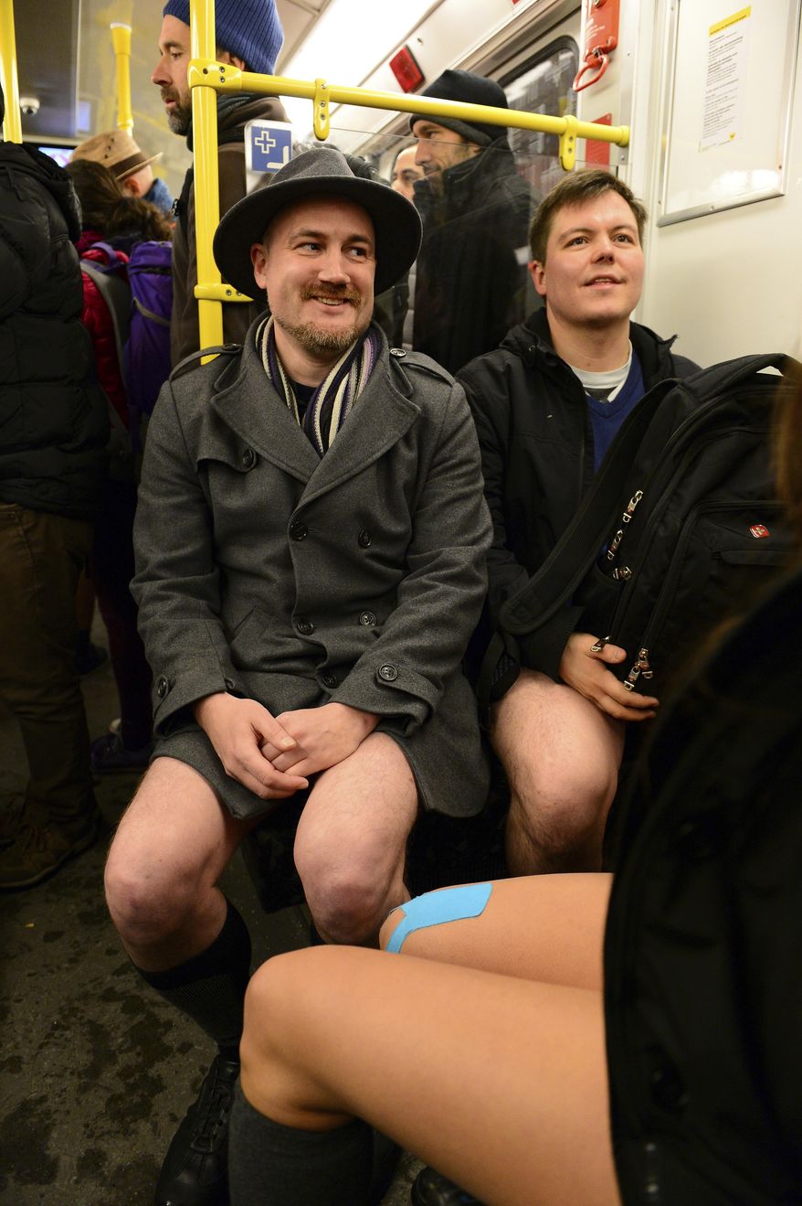 Young people with no pants ride the subway train during the event 'No Pants Subway Ride' in Berlin, Germany, Sunday Jan. 8, 2017. What started in New York City in 2002 with a just a handful of people has blossomed into a worldwide movement involving thousands. No Pants rides are scheduled Sunday in about 50 cities across the U.S., Canada, Europe and Australia. (Maurizio Gambarini/dpa via AP)