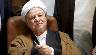 FILE - In this Dec. 21, 2015 file photo, former Iranian President Akbar Hashemi Rafsanjani, registers his candidacy for the elections of the Experts Assembly in Tehran, Iran. Iranian state media said Sunday, Jan. 8, 2017 that influential former President Akbar Hashemi Rafsanjani has died at age 82 after having been hospitalized because of a heart condition. Rafsanjani, who served as president from 1989 to 1997, was a leading politician who often played kingmaker in the country&#39;s turbulent politics. He supported President Hassan Rouhani. (AP Photo/Ebrahim Noroozi, File)