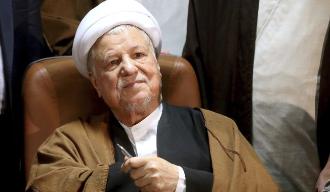 FILE - In this Dec. 21, 2015 file photo, former Iranian President Akbar Hashemi Rafsanjani, registers his candidacy for the elections of the Experts Assembly in Tehran, Iran. Iranian state media said Sunday, Jan. 8, 2017 that influential former President Akbar Hashemi Rafsanjani has died at age 82 after having been hospitalized because of a heart condition. Rafsanjani, who served as president from 1989 to 1997, was a leading politician who often played kingmaker in the country&#x27;s turbulent politics. He supported President Hassan Rouhani. (AP Photo/Ebrahim Noroozi, File)