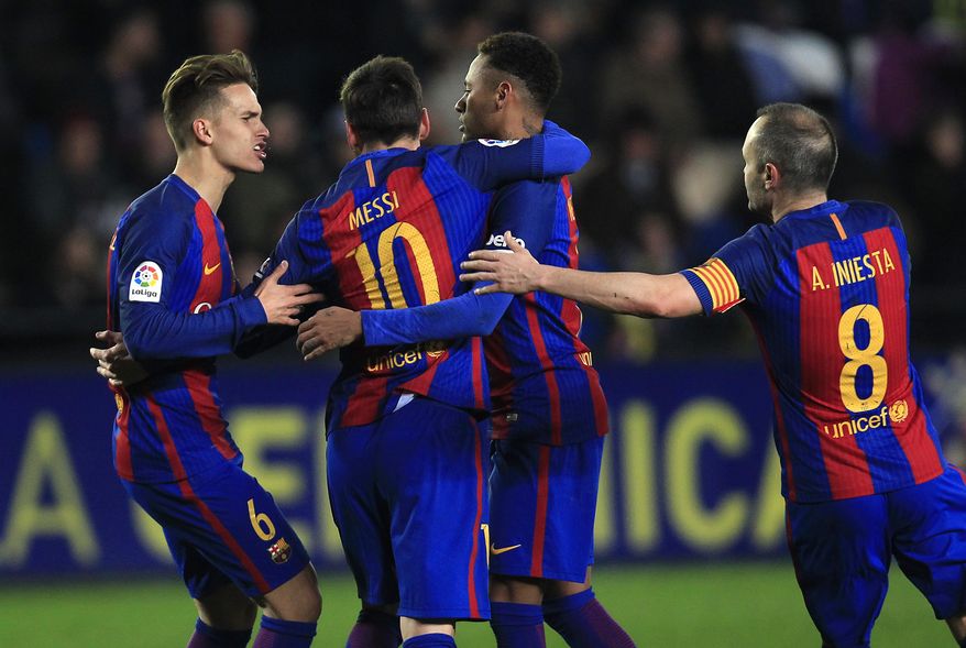 FC Barcelona's Lionel Messi, center, celebrates after scoring with teammates Denis Suarez, left, Neymar, second left, and Iniesta during the Spanish La Liga soccer match between Villarreal and Barcelona at the Ceramica stadium in Villarreal, Spain, Sunday, Jan. 8, 2017. (AP Photo/Alberto Saiz)