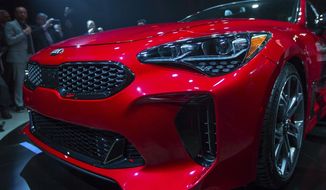 Kia Motors America unveils the 2018 Kia Stinger during the North American International Auto Show in Detroit, Sunday, Jan. 8, 2017. (Matt Weigand/The Ann Arbor News via AP)