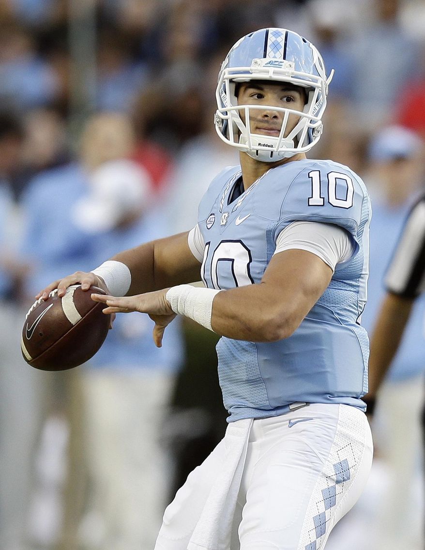 FILE - In this Nov. 19, 2016, file photo, North Carolina quarterback Mitch Trubisky (10) looks to pass against The Citadel during the first half of an NCAA college football game in Chapel Hill, N.C. Trubisky said Monday, Jan. 9, 2017, that he plans to skip his senior season and enter the NFL draft. (AP Photo/Gerry Broome, File)