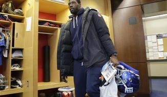 New York Giants defensive end Jason Pierre-Paul takes some of his gear out of the NFL football team&#39;s locker room in East Rutherford, N.J., Monday, Jan. 9, 2017. (AP Photo/Seth Wenig)