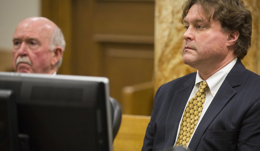 Robert Rhodes, of Sugar Land, Texas, right, faces a judge with his attorney Joseph  Cahill as Rhodes enters a plea in Polk County District Court Jan. 9, 2017 in Des Moines, Iowa. Rhodes pleaded guilty to a fraud charge and admitted to participating in a scheme to help his friend, Eddie Tipton, a lottery computer technician in Iowa, cash jackpots after Tipton figured out a way to predict numbers for certain games in several states including  Colorado, Kansas, Oklahoma and Wisconsin. (Rodney White/The Register via AP)