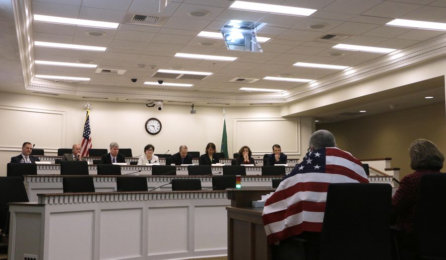 Member of the bipartisan Education Funding Task Force listen to public testimony on Monday, Jan. 9, 2017 in Olympia, Wash. Lawmakers returned to the Capitol for a 105-day legislative session, tasked with the final piece of an education funding puzzle they have spent years trying to solve. (AP Photo/Rachel La Corte)