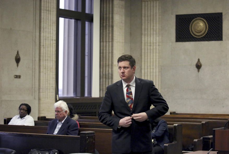 Chicago Police Officer Jason Van Dyke approaches the bench for his hearing with Judge Vincent Gaughan at the Leighton Criminal Courts Building in Chicago Tuesday Jan. 10, 2017, in Chicago. Van Dyke is charged with murder in the October 2014 death of Laquan McDonald, who was shot 16 times. The Cook County judge on Tuesday ordered the release of McDonald's juvenile records, except for records about his birth mother and sister. (Nancy Stone/Chicago Tribune via AP, Pool)