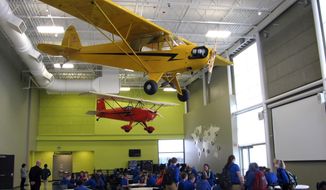 In this Jan. 4, 2017, photo, students gather between classes at West Michigan Aviation Academy in Grand Rapids, Mich. The charter high school at Gerald R. Ford International Airport was founded by Dick DeVos, a pilot and husband of Betsy DeVos, who is President-elect Donald Trump&#x27;s nominee for Education Department Secretary. Betsy DeVos played a key role in encouraging her husband to set up a Western Michigan charter school, an education philosophy likely to continue if she’s confirmed by the Senate as education secretary. DeVos faces a Senate panel considering her nomination on Jan. 11. (AP Photo/Ed White)