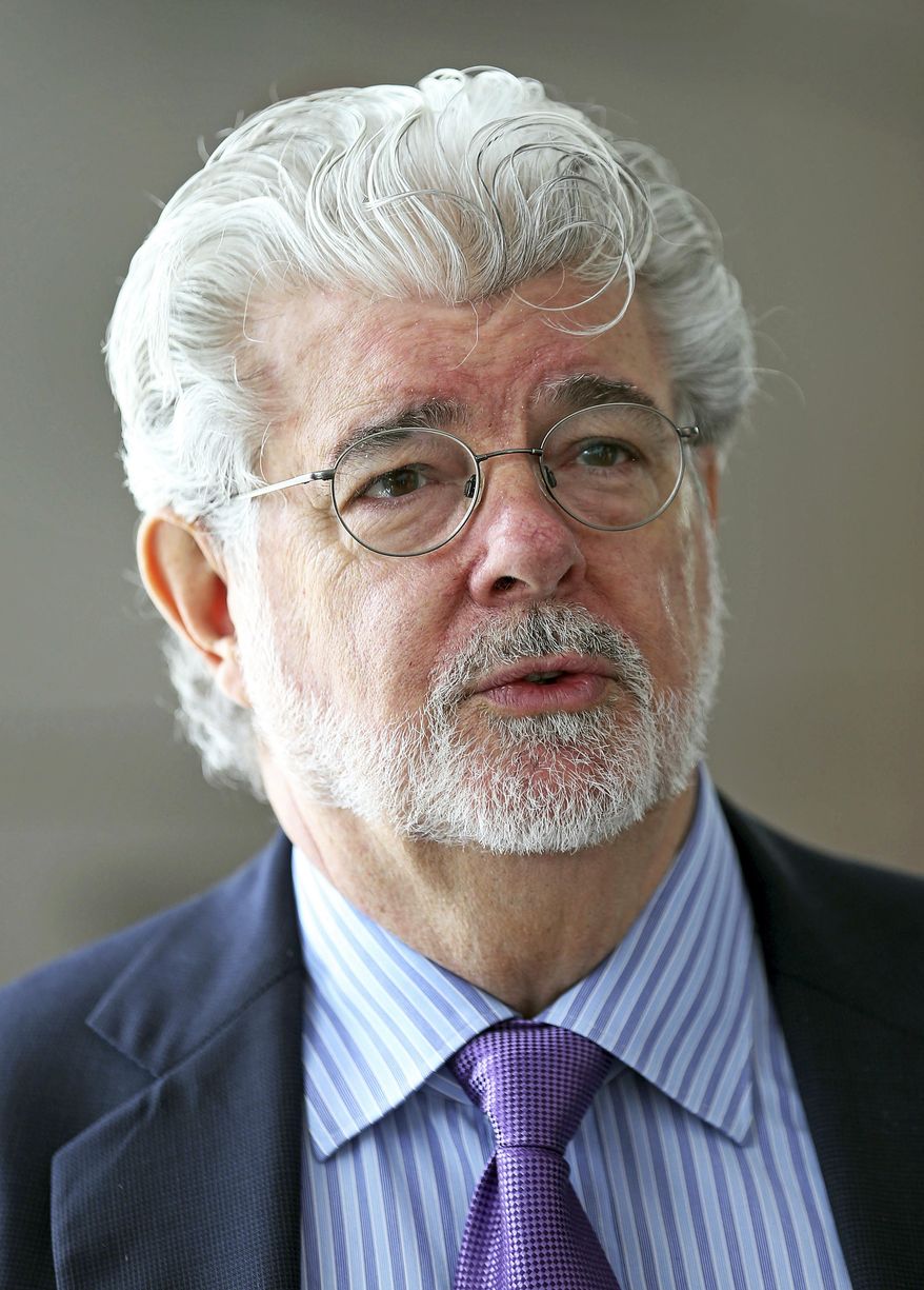 In this Jan. 16, 2014, file photo, George Lucas speaks at an event in Singapore. "Star Wars" creator Lucas and his team announced Tuesday, Jan. 10, 2017, they have chosen Los Angeles over San Francisco as the home of the museum that will showcase his work. After what organizers called an extremely difficult decision, they announced Tuesday that the museum will be built in Exposition Park in Los Angeles, where it will sit alongside other more traditional museums. (AP Photo/Wong Maye-E, File)