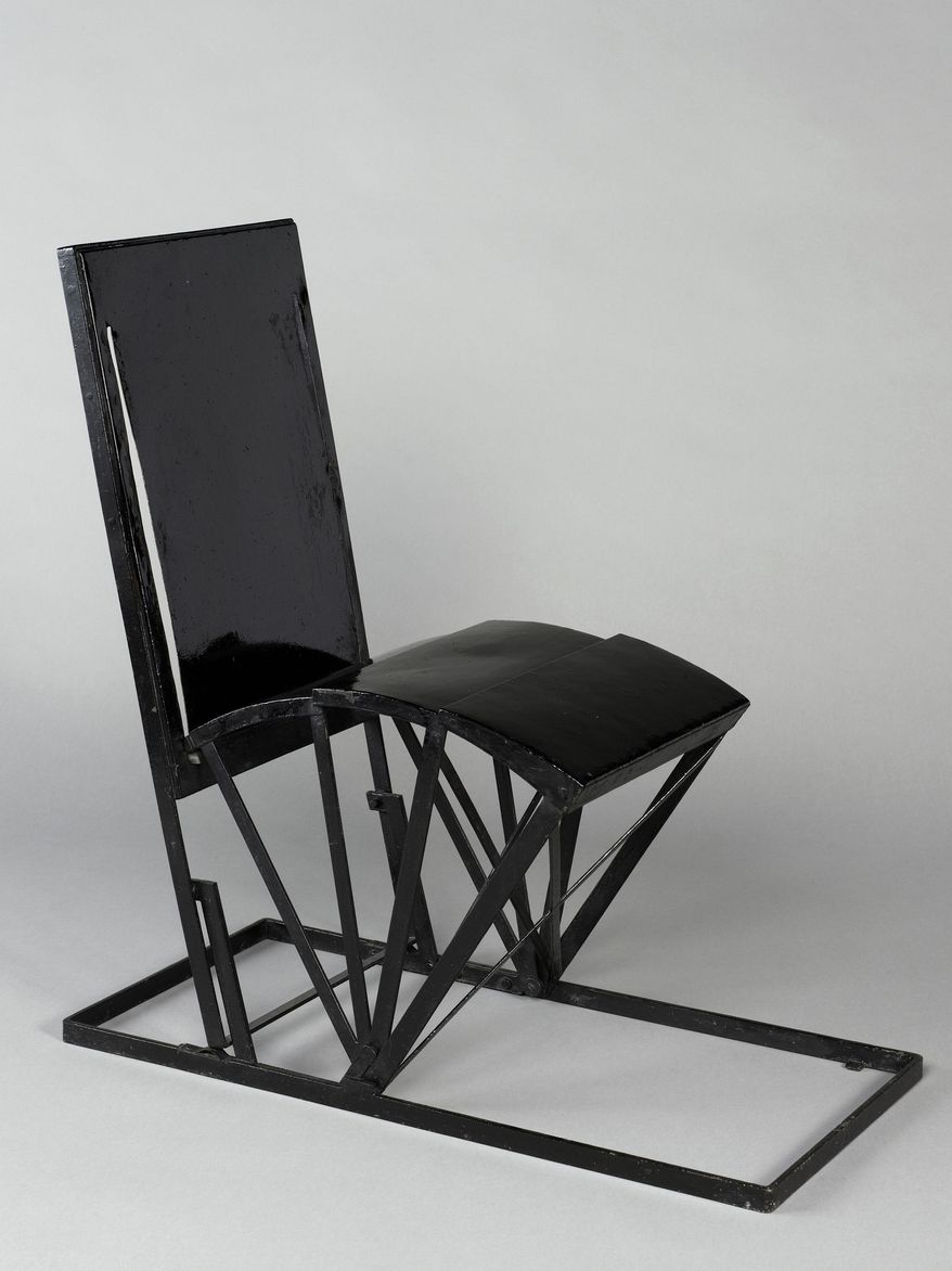 This undated photo provided by the Jewish Museum shows Pierre Chareau's folding chair, metal and paint. The chair is part of the exhibition "Pierre Chareau: Modern Architecture and Design," at The Jewish Museum in New York.(Bertrand Prévost/The Jewish Museum via AP)