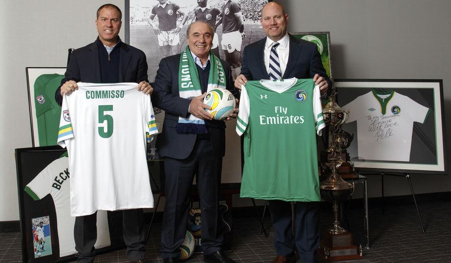 In this image provided by the New York Cosmos, Rocco B. Commisso, center, the New York Cosmos&#39; new owner, poses with coach Giovanne Savarese, left, and chief operating office Erik Stover, Tuesday, Jan. 10, 2017, in New York. Commisso, chief executive of Mediacom Communications Corp. and a former soccer player at Columbia, said Tuesday he purchased majority ownership of the team in the second-tier North American Soccer League and will become the club’s chairman. (New York Cosmos via AP)